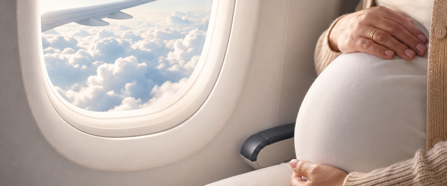 A pregnant woman seated by an aircraft window